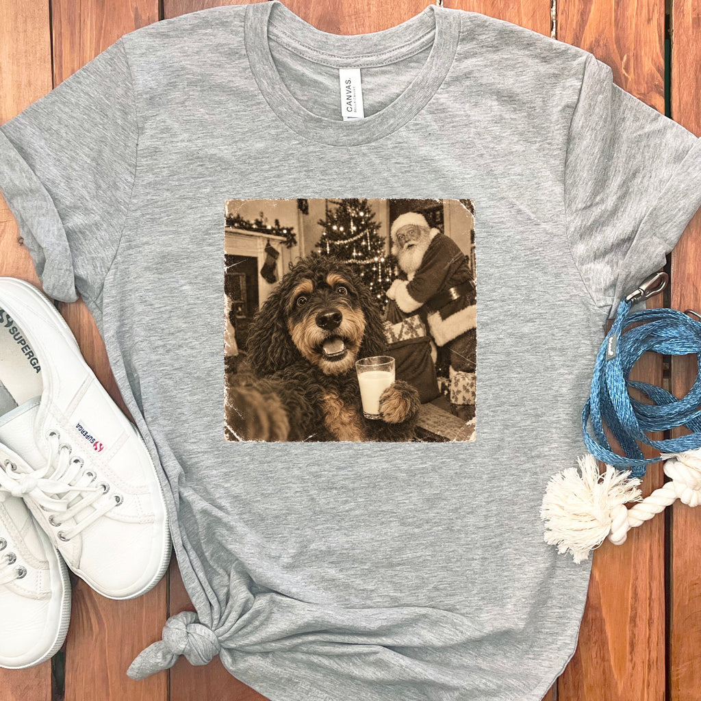 Heather gray crewneck t-shirt featuring a vintage sepia-toned graphic of a dog holding a glass of milk with Santa Claus in the background.