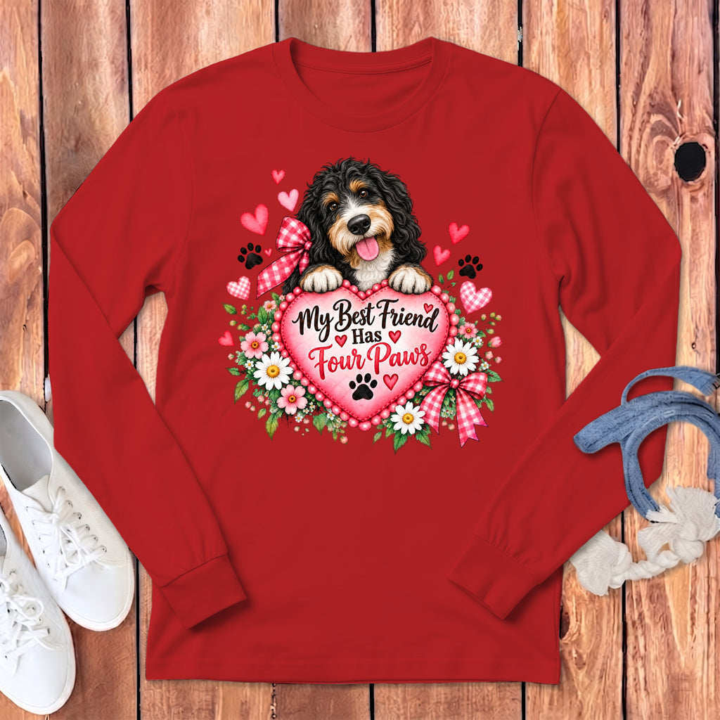 Red long-sleeve t-shirt featuring a bernedoodle puppy holding a pink heart with flowers and text.