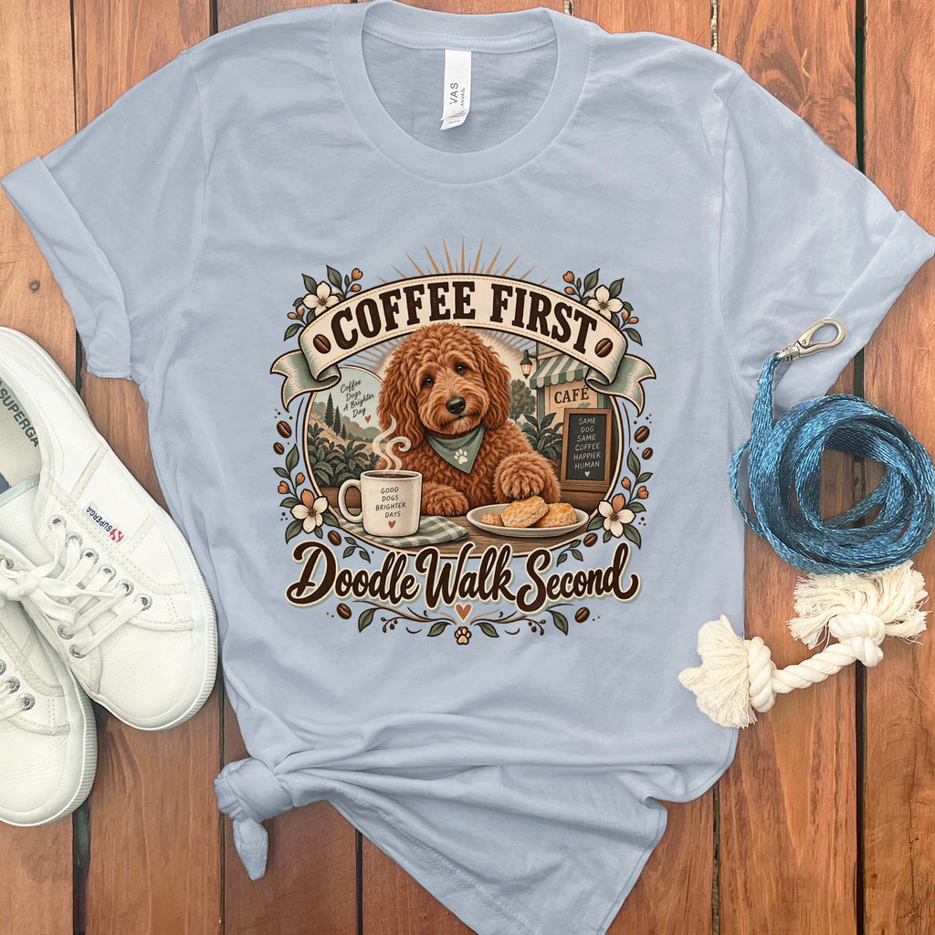 Light blue t-shirt with "Coffee First Doodle Walk Second" design featuring a dog, coffee, and cookies.
