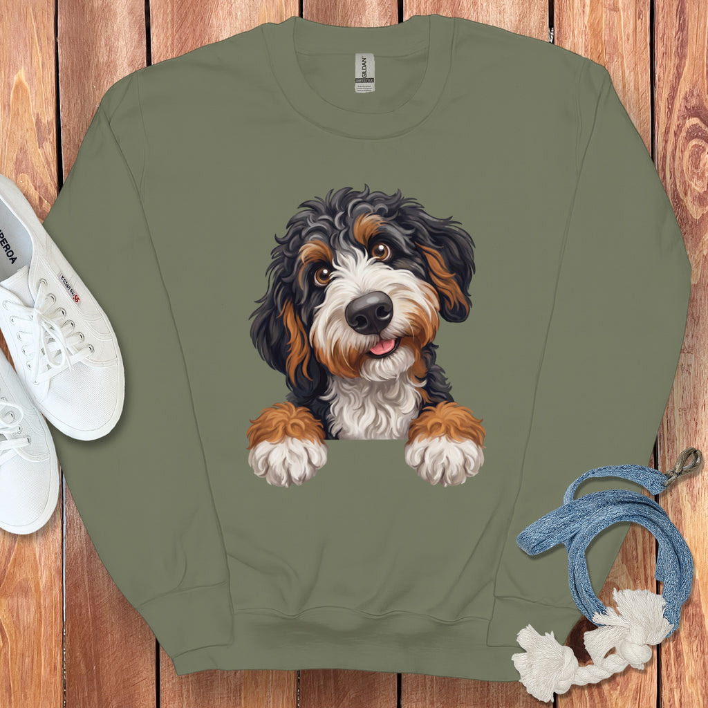 Olive green sweatshirt with a cartoon Bernese Mountain Dog graphic.