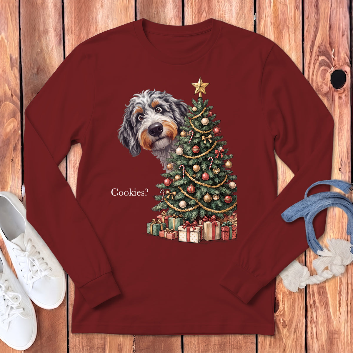 Bernedoodle peeks around a decorated Christmas tree with gifts and text "Cookies?".