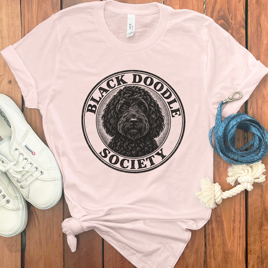 Black doodle portrait with "Black Doodle Society" text in a circular emblem.