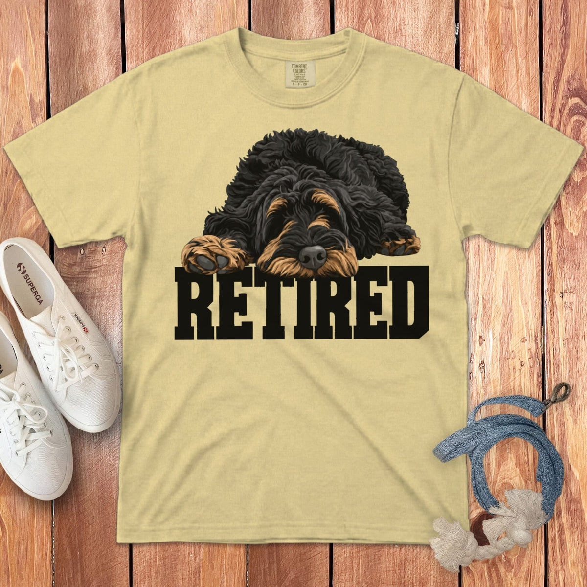T-shirt with a scruffy dog illustration and the word "RETIRED."