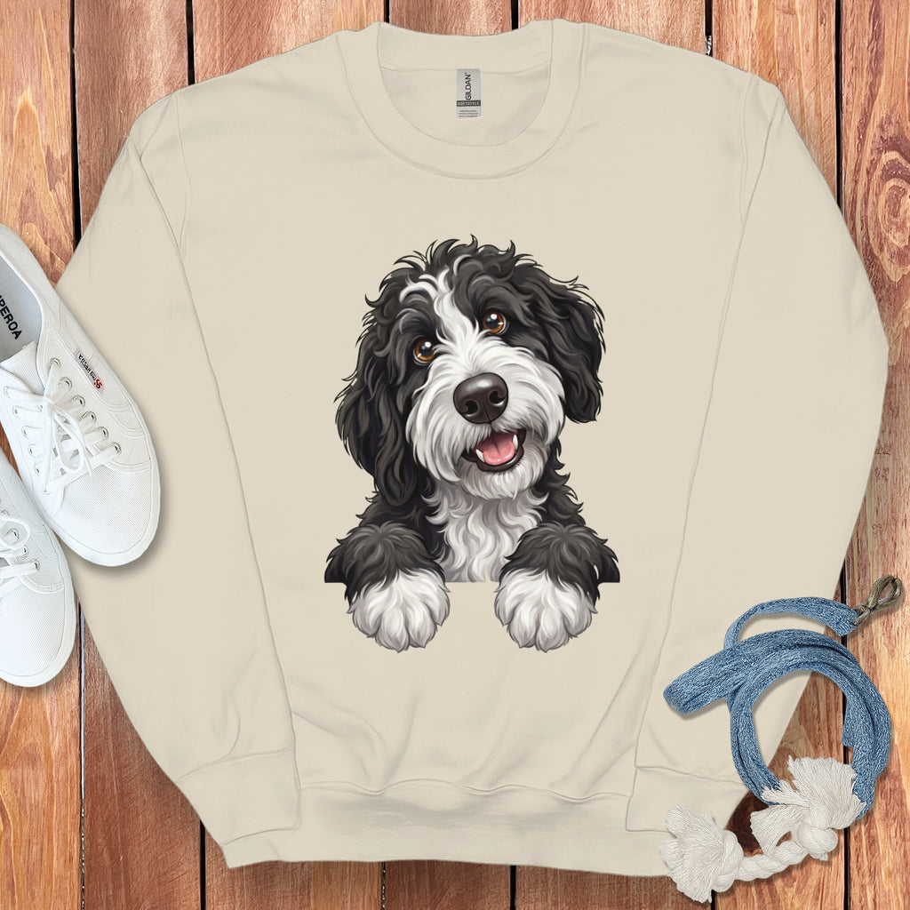 Cream sweatshirt with a black and white fluffy dog print and white sneakers.
