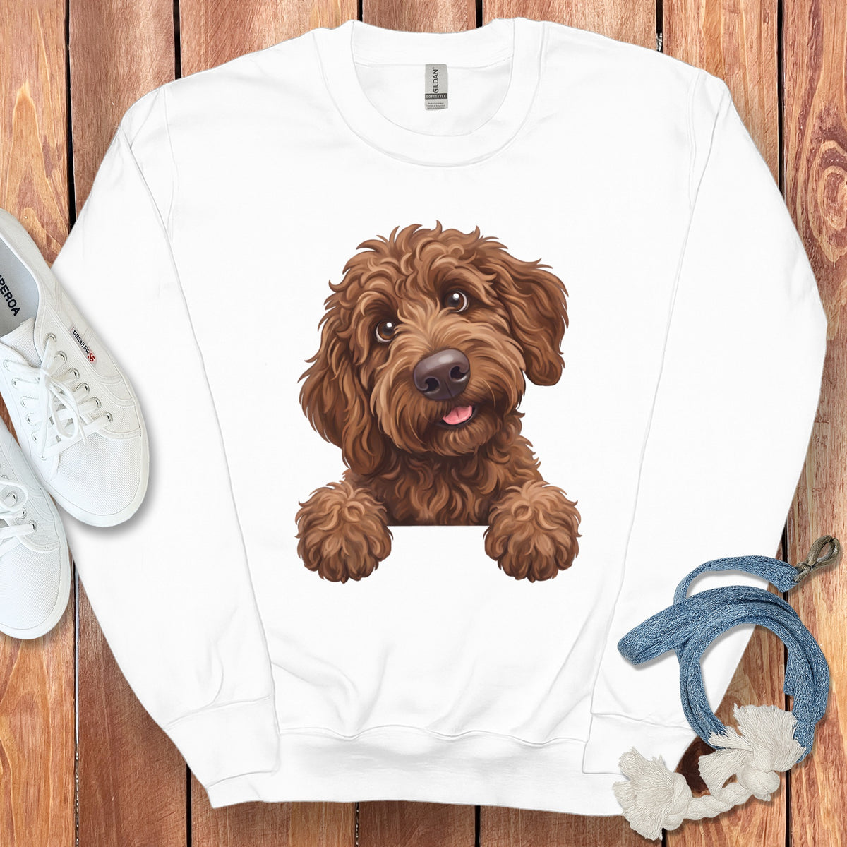 White sweatshirt with a brown doodle dog graphic peeking over the neckline.