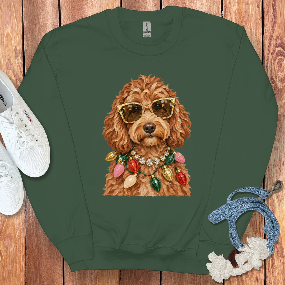 Green sweatshirt with a doodle dog wearing sunglasses and a Christmas light necklace.