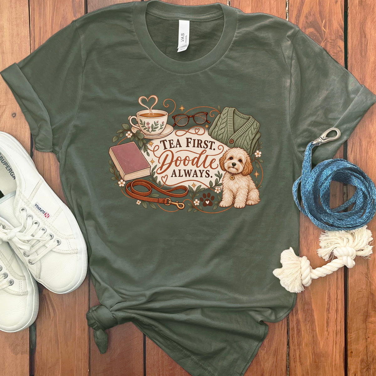 Olive green t-shirt with "Tea First. Doodle Always." graphic and a dog.