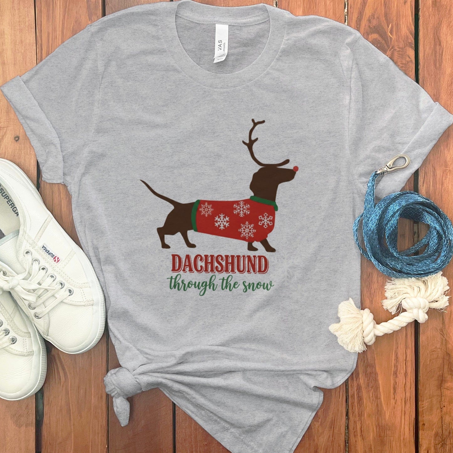 Dachshund through the snow graphic t-shirt product