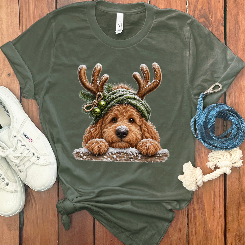 T-shirt with a doodle dog wearing antlers, a green hat, and Christmas bells.