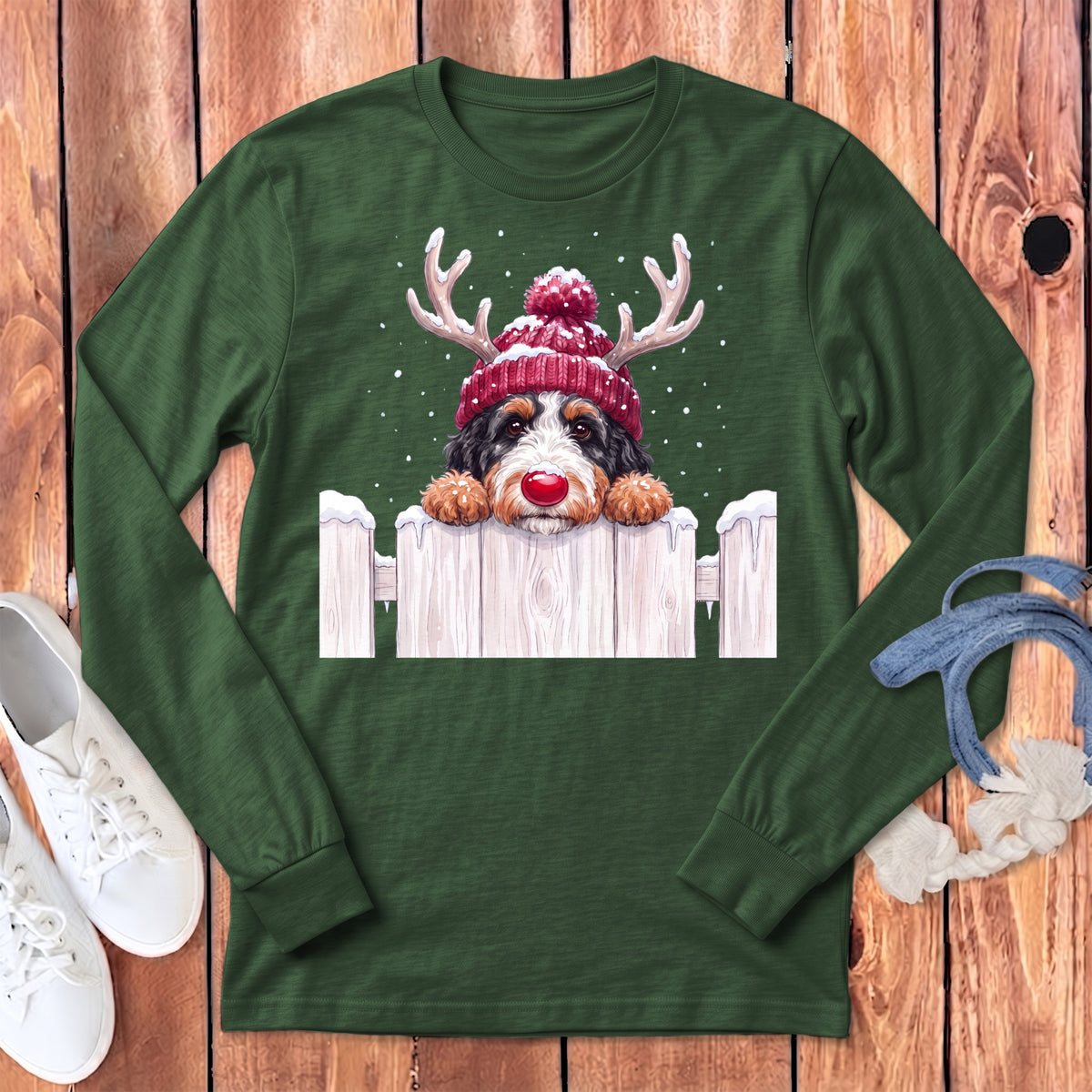 Green long sleeve shirt with a Bernese Mountain Dog wearing a Santa hat and reindeer antlers.