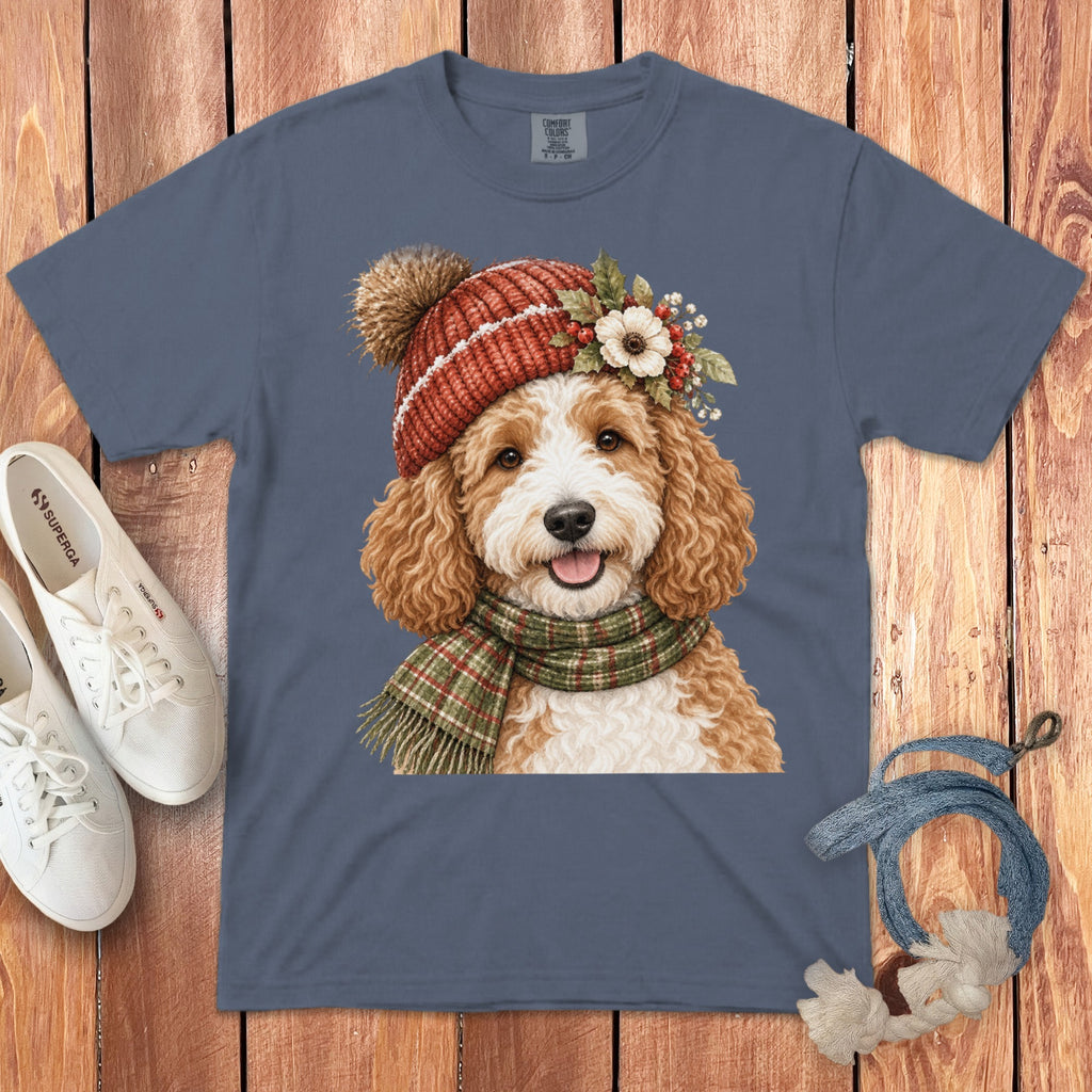 T-shirt featuring a watercolor doodle dog wearing a festive hat and scarf.