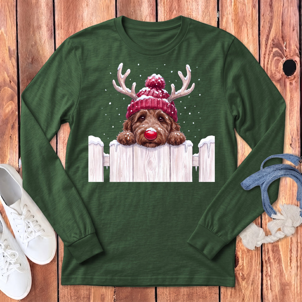 Brown dog wearing reindeer antlers and red hat peeks over a fence.