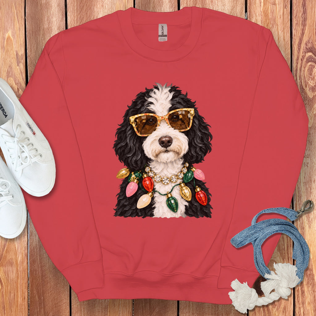 Red sweatshirt with a doodle dog wearing sunglasses and Christmas lights.