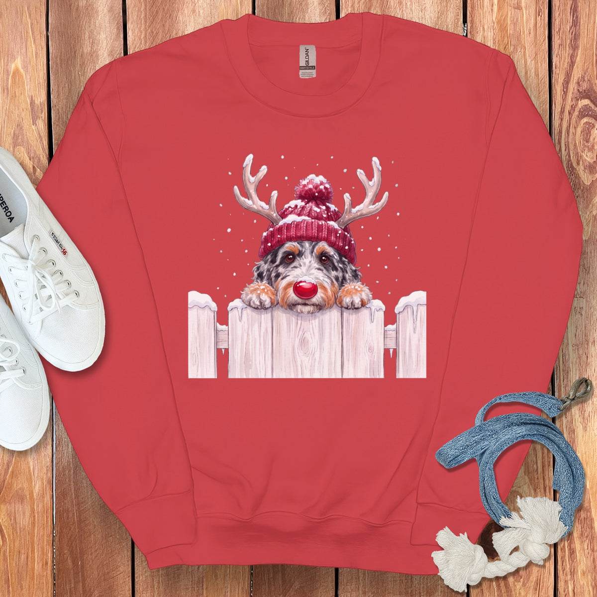 Red sweatshirt with a watercolor dog wearing a reindeer hat and red nose.