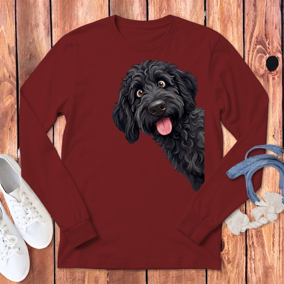 Long sleeve maroon t-shirt with a playful black doodle dog illustration.