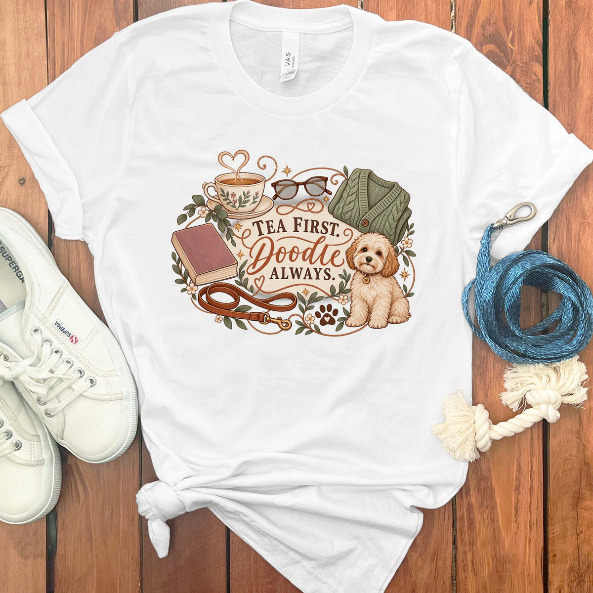 White t-shirt graphic with "Tea First. Doodle Always." text and a doodle dog.