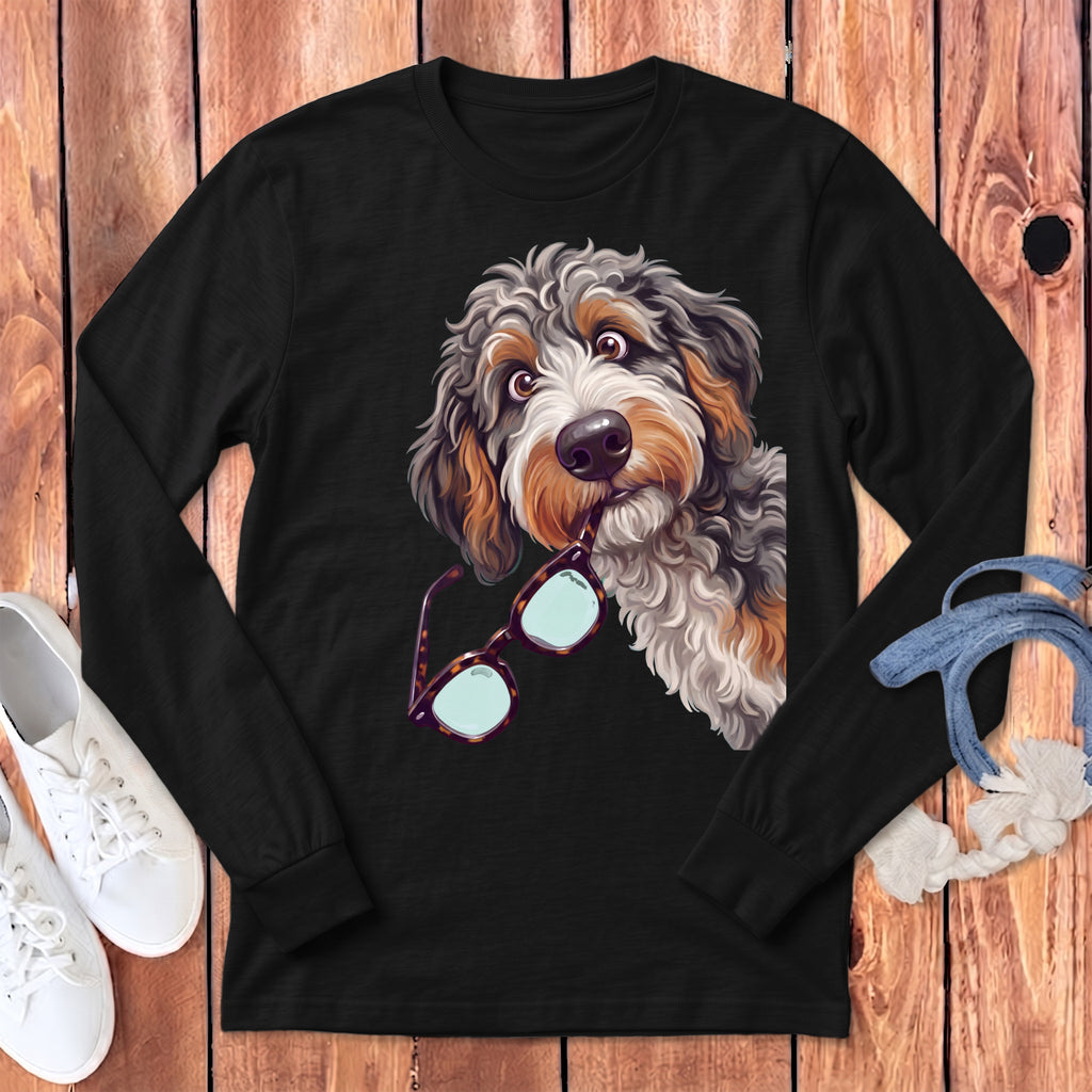 Black long-sleeve t-shirt featuring a graphic of a fluffy dog holding glasses in its mouth.