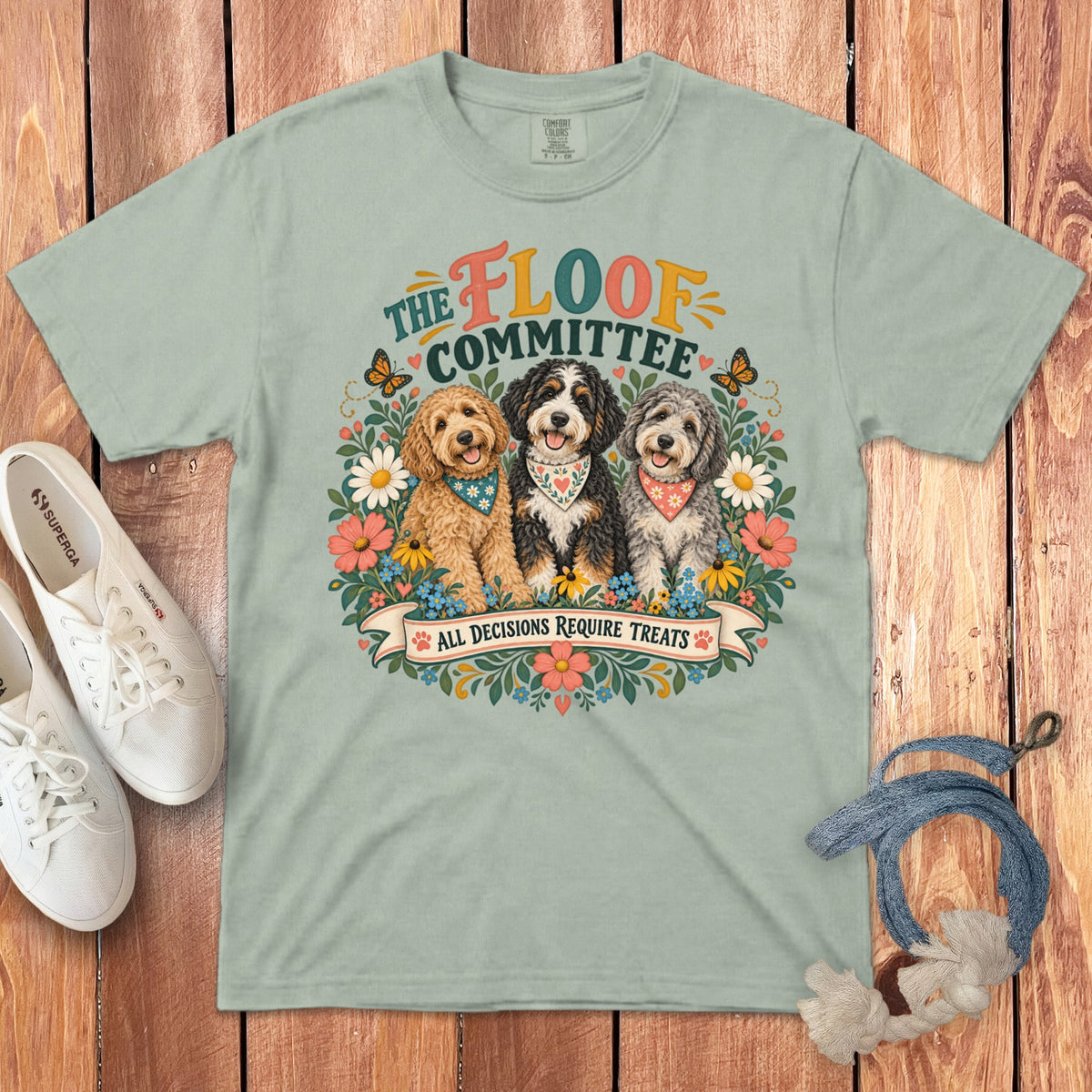 Light mint t-shirt with three dogs, flowers, and text: "The Floof Committee All Decisions Require Treats".