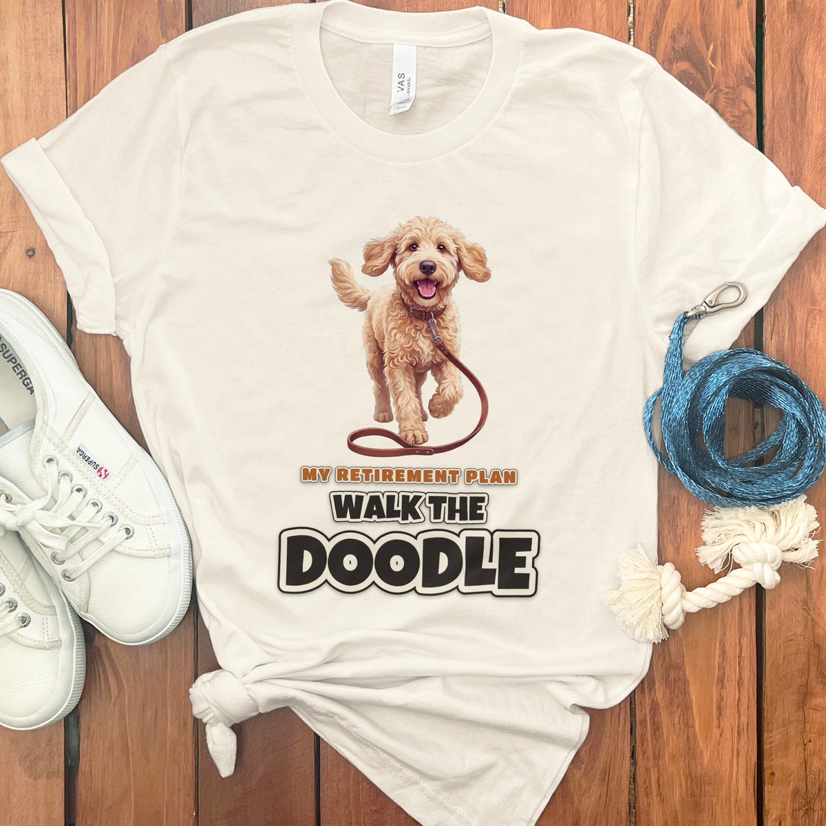 Cream t-shirt with a doodle dog graphic and text "My Retirement Plan Walk the Doodle".