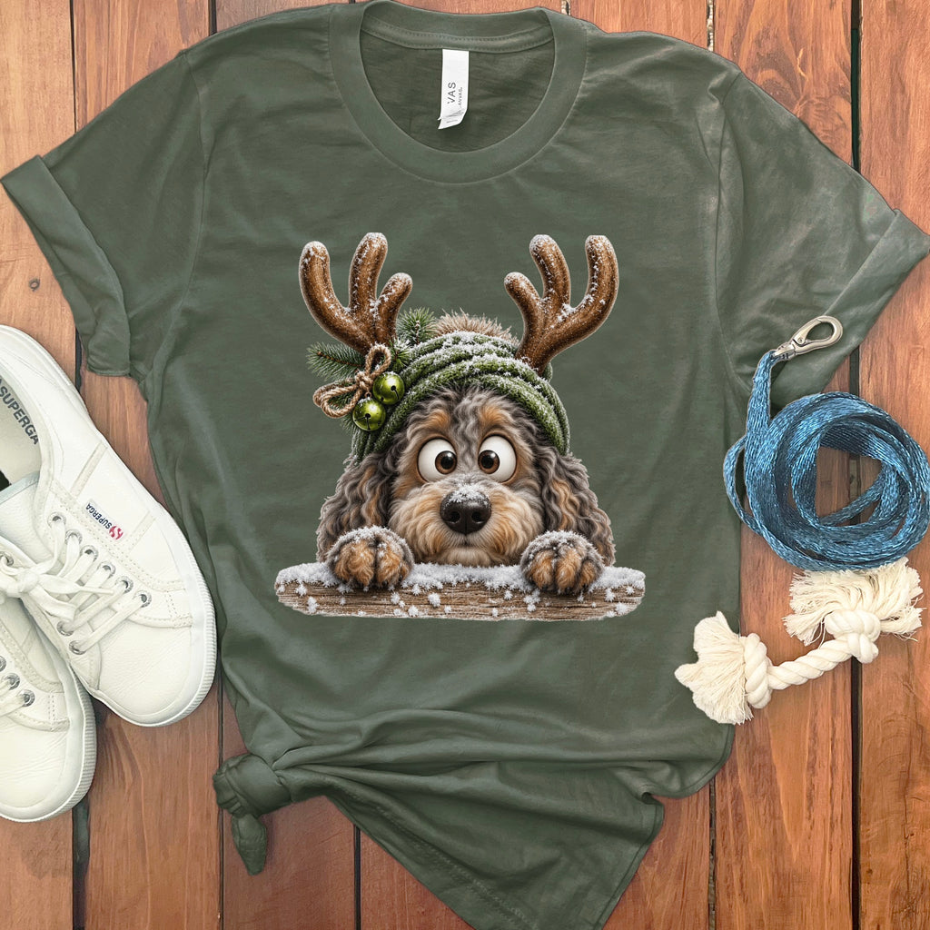 Green t-shirt with a cartoon dog wearing antlers and a knitted hat.