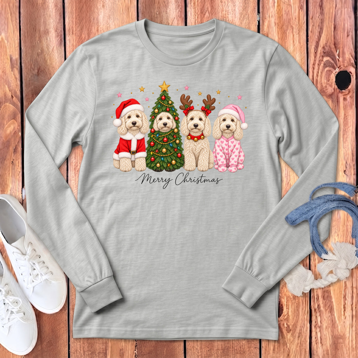 Light gray long-sleeve t-shirt with a graphic of four doodle dogs celebrating Christmas, featuring the text Merry Christmas.