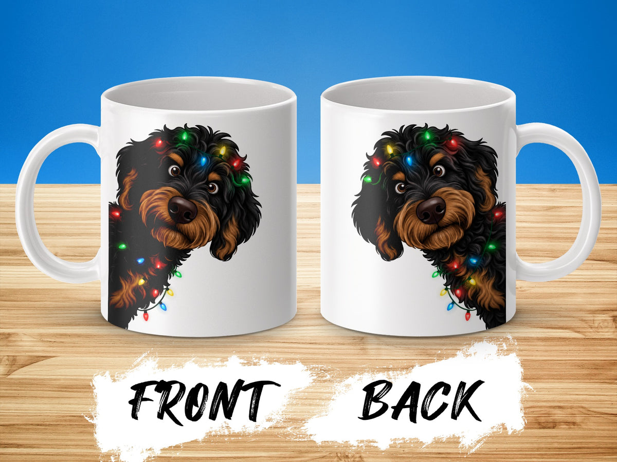 Two white mugs, front and back views, with a shaggy dog and Christmas lights design.