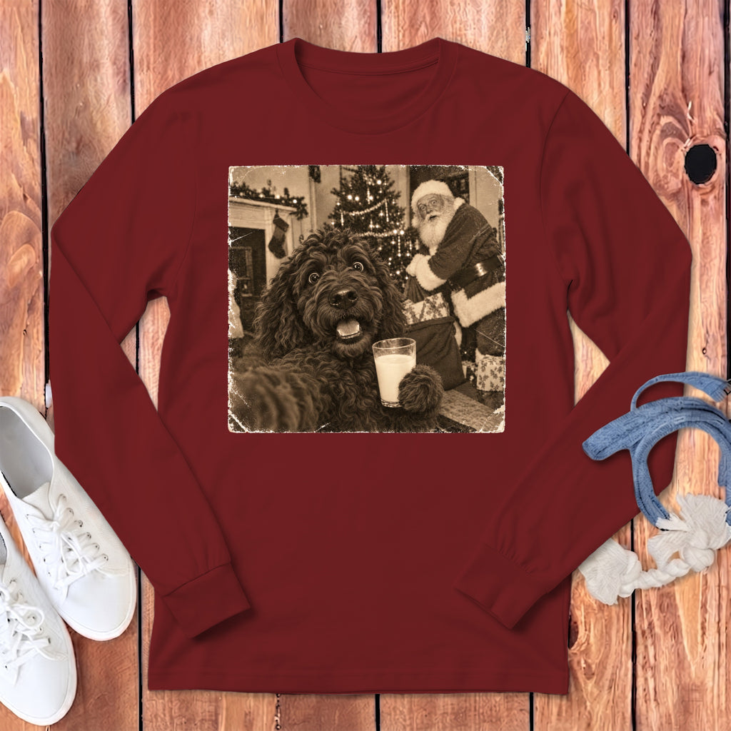 Maroon long-sleeved shirt with a graphic of a black dog holding a glass of milk near Santa.