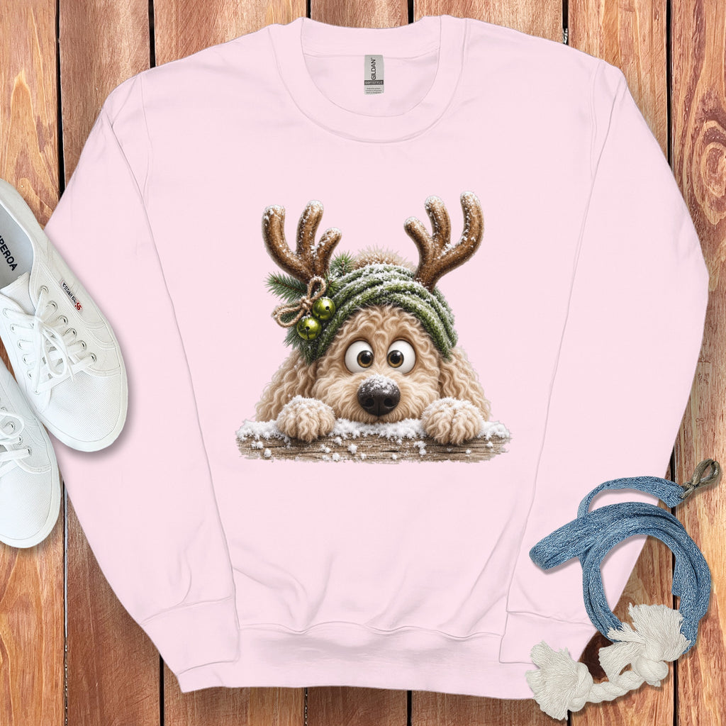 Pink sweatshirt with a fluffy dog wearing reindeer antlers and a winter hat.