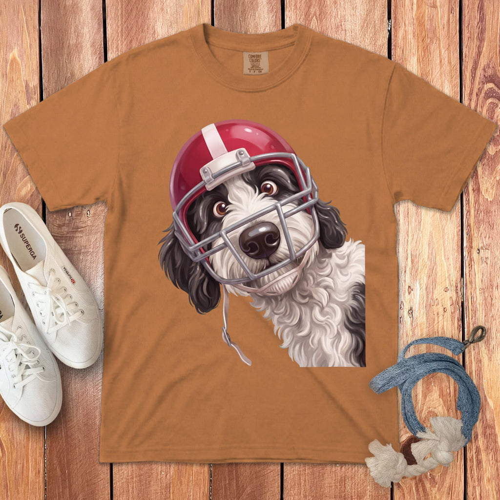 T-shirt with illustration of a black and white dog wearing a red football helmet.