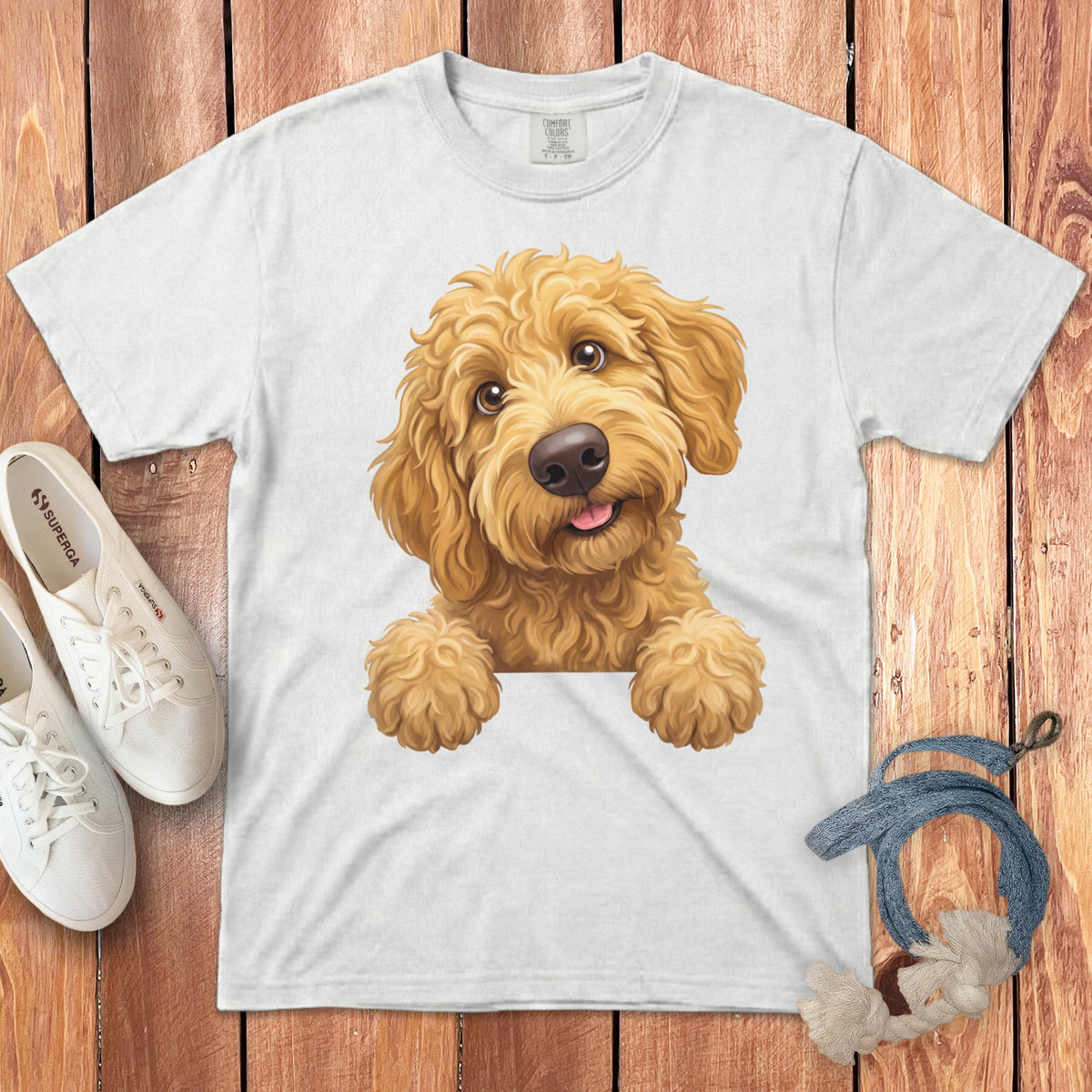 White t-shirt with a digital illustration of a happy golden doodle puppy.