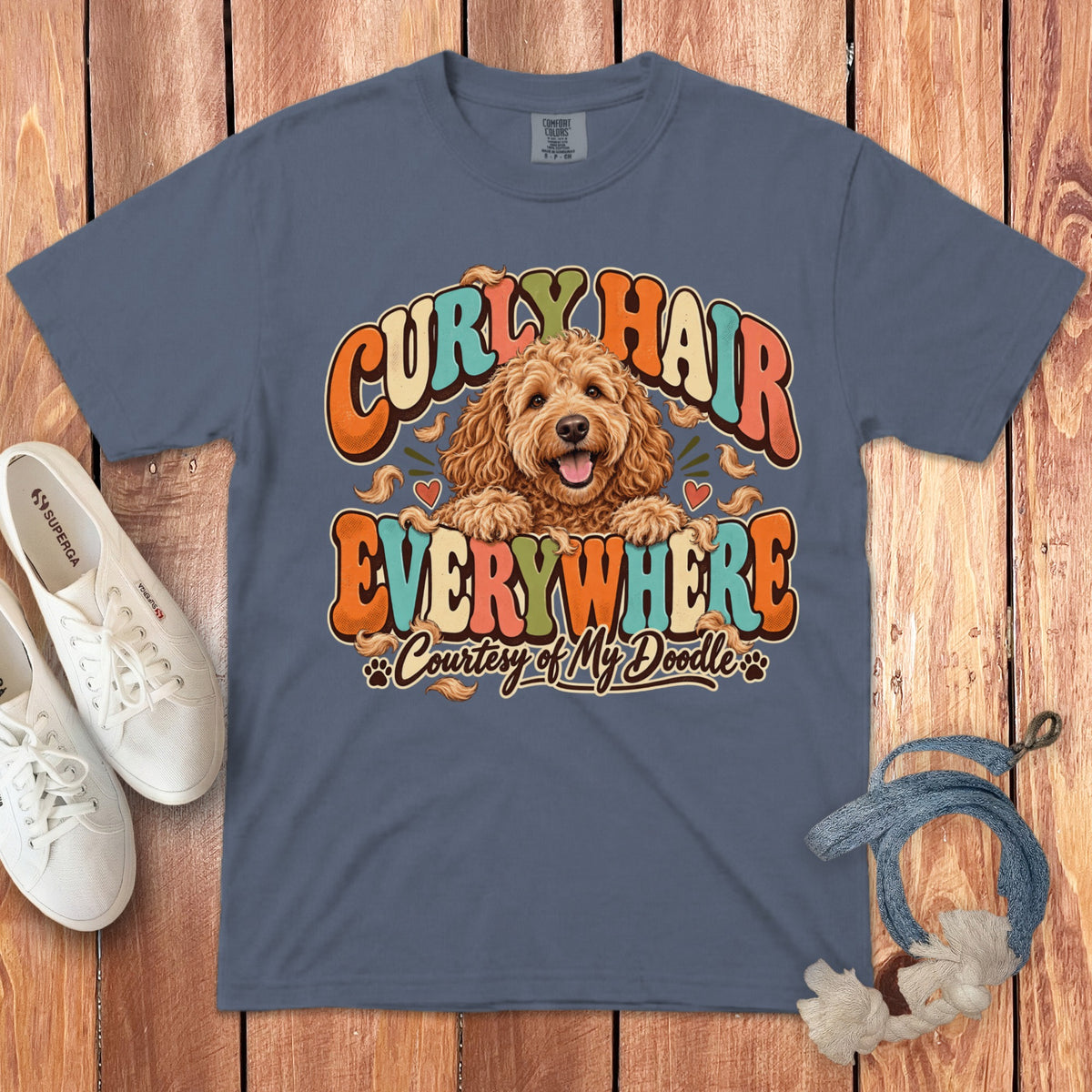 T-shirt with doodle dog and "Curly Hair Everywhere" text.