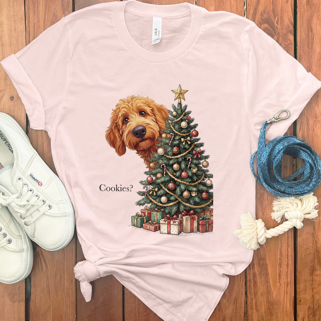 Pink t-shirt with a doodle dog and Christmas tree graphic that reads "Cookies?"