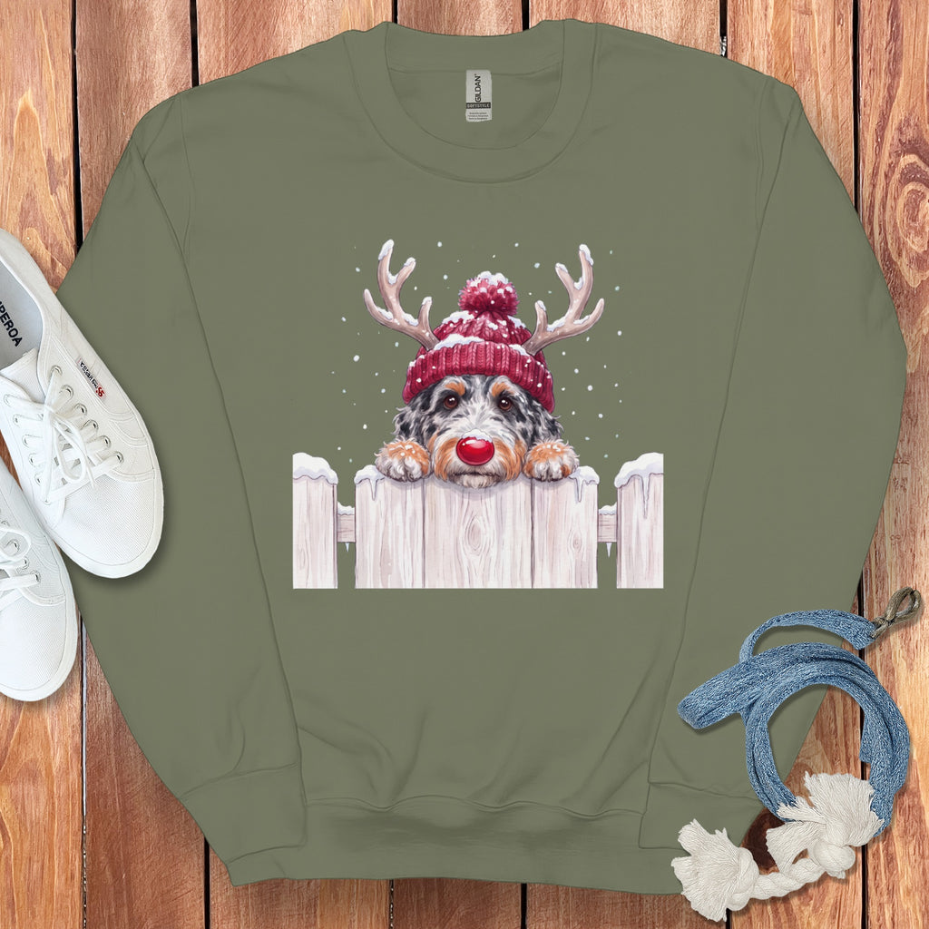 Crewneck sweatshirt with a dog wearing a red beanie and antlers.