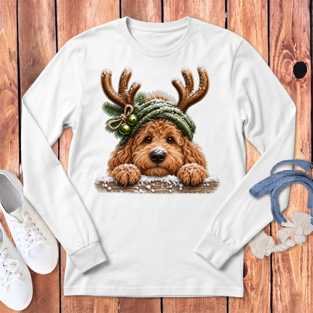 White long-sleeve shirt with a doodle dog wearing reindeer antlers and a snowy hat.