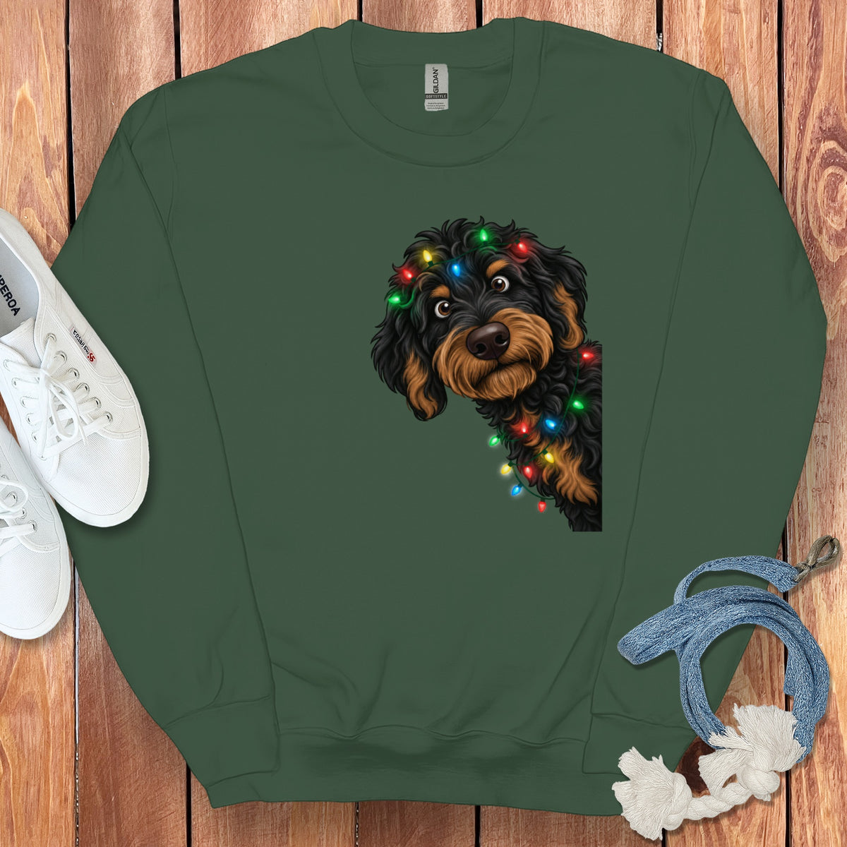 Dark green sweatshirt with a dog wearing colorful Christmas lights on its head.