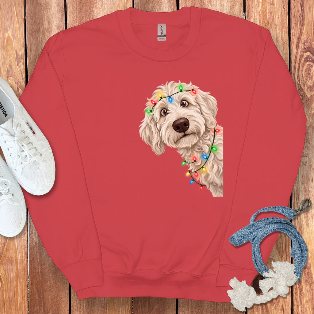 Red sweatshirt with a doodle dog wearing Christmas lights graphic.