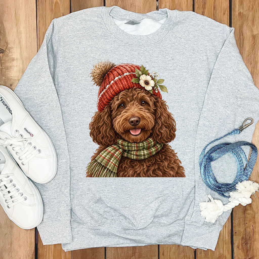 Grey sweatshirt with a cute brown dog wearing a knitted hat and scarf.