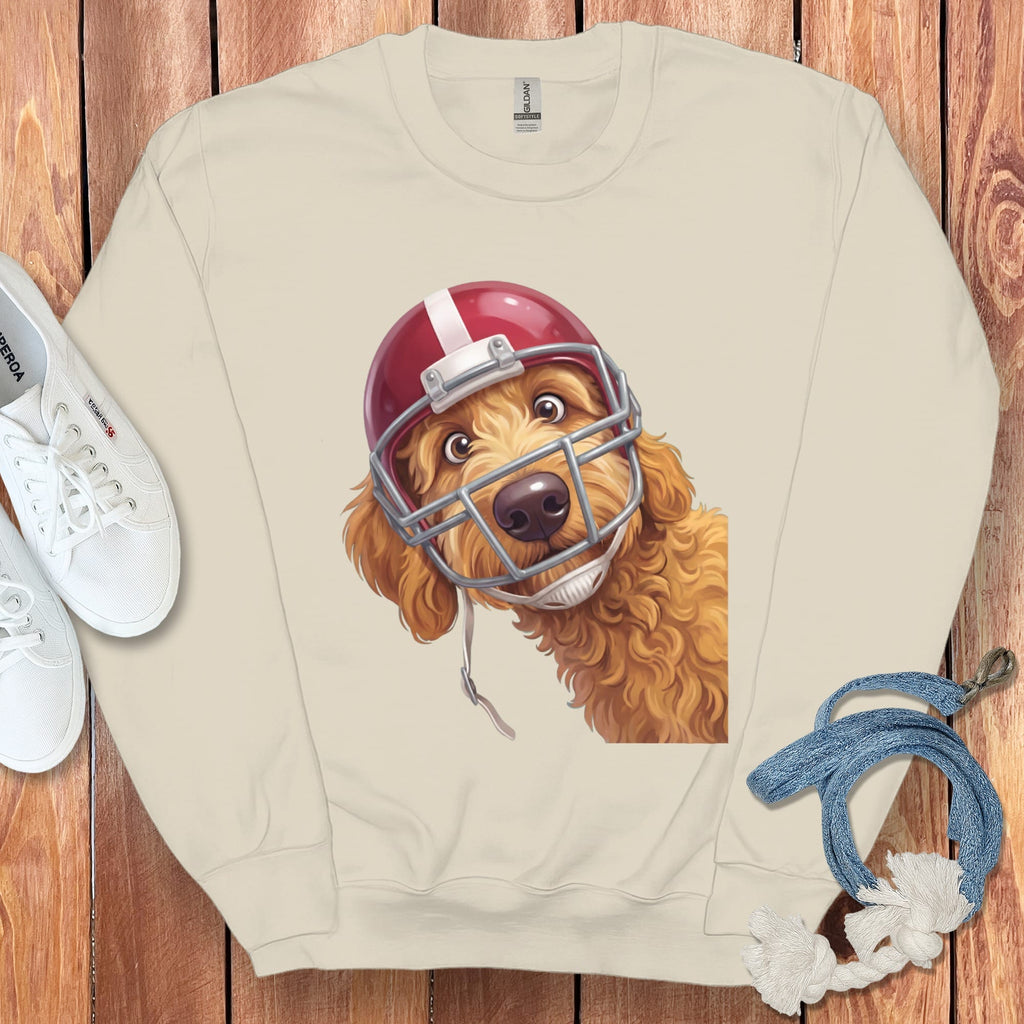 Cream sweatshirt with a cartoon goldendoodle wearing a red football helmet.