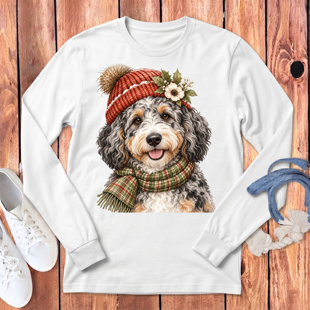 White long-sleeve shirt with a doodle dog wearing a knit hat and plaid scarf.