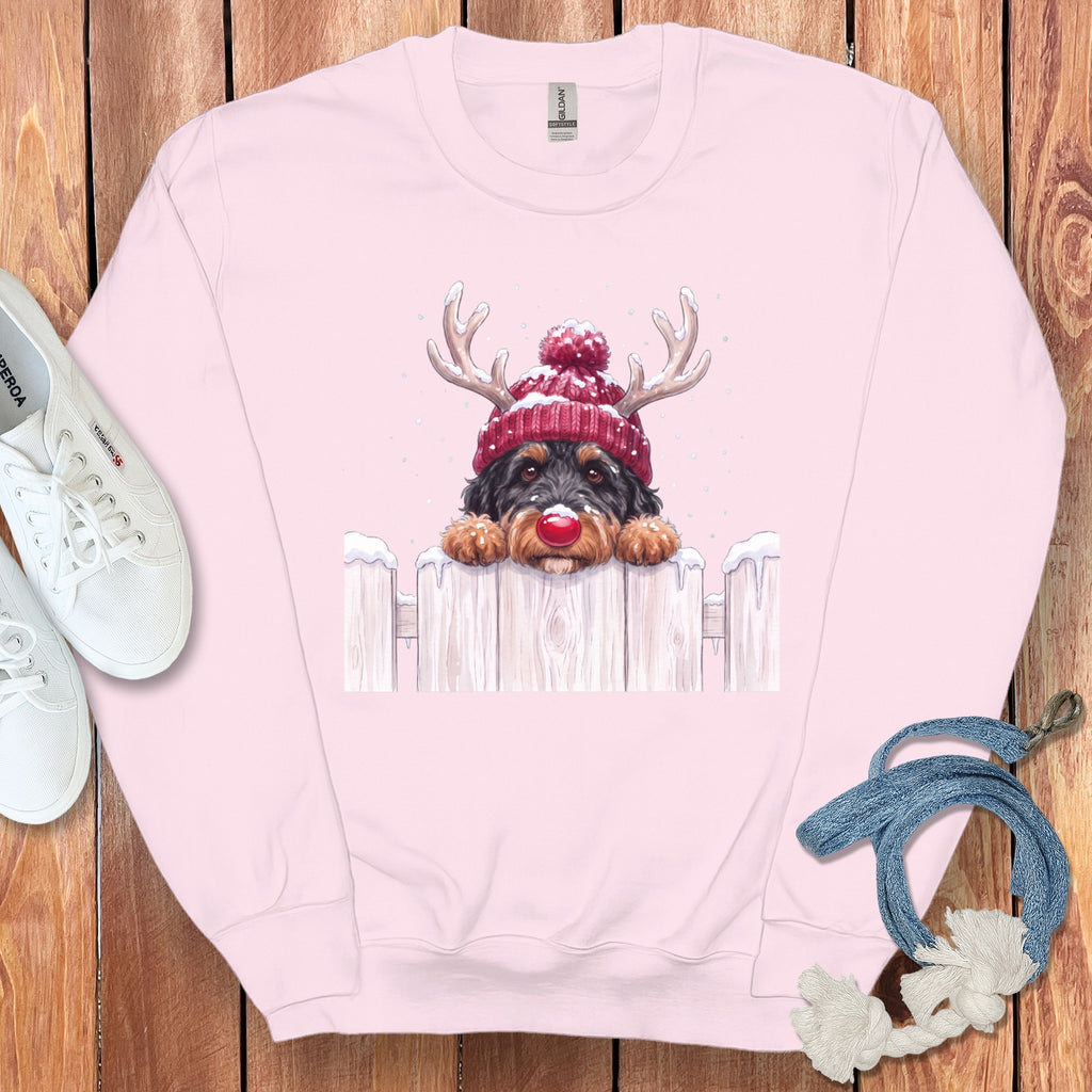 Pink sweatshirt with a watercolor illustration of a dog wearing a Santa hat.