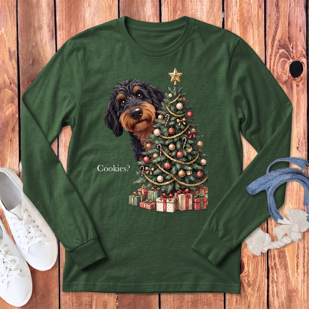 Long sleeve t-shirt with a dachshund peeking from behind a decorated Christmas tree.