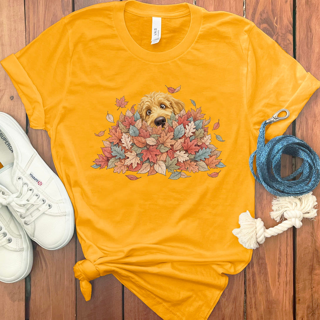 Golden Goldendoodle Peeking Leaf Pile T-Shirt in Gold / S by Puppy Jo