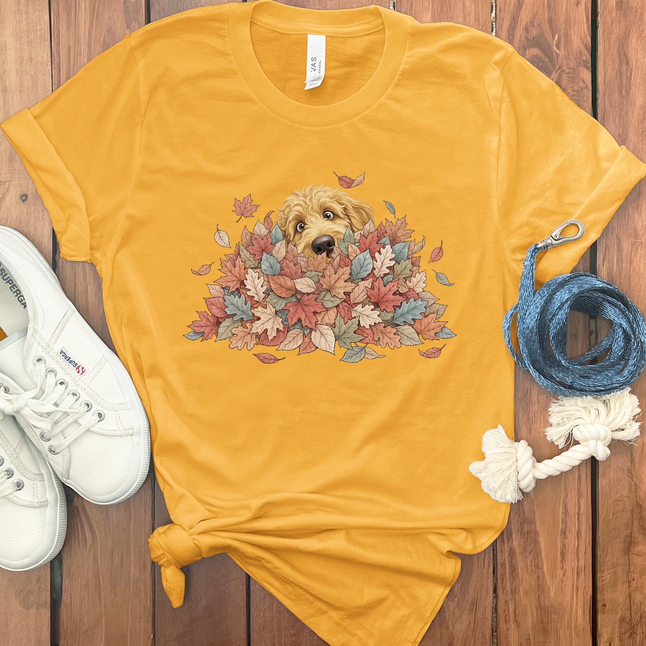 Golden Goldendoodle Peeking Leaf Pile T-Shirt in Gold / S by Puppy Jo