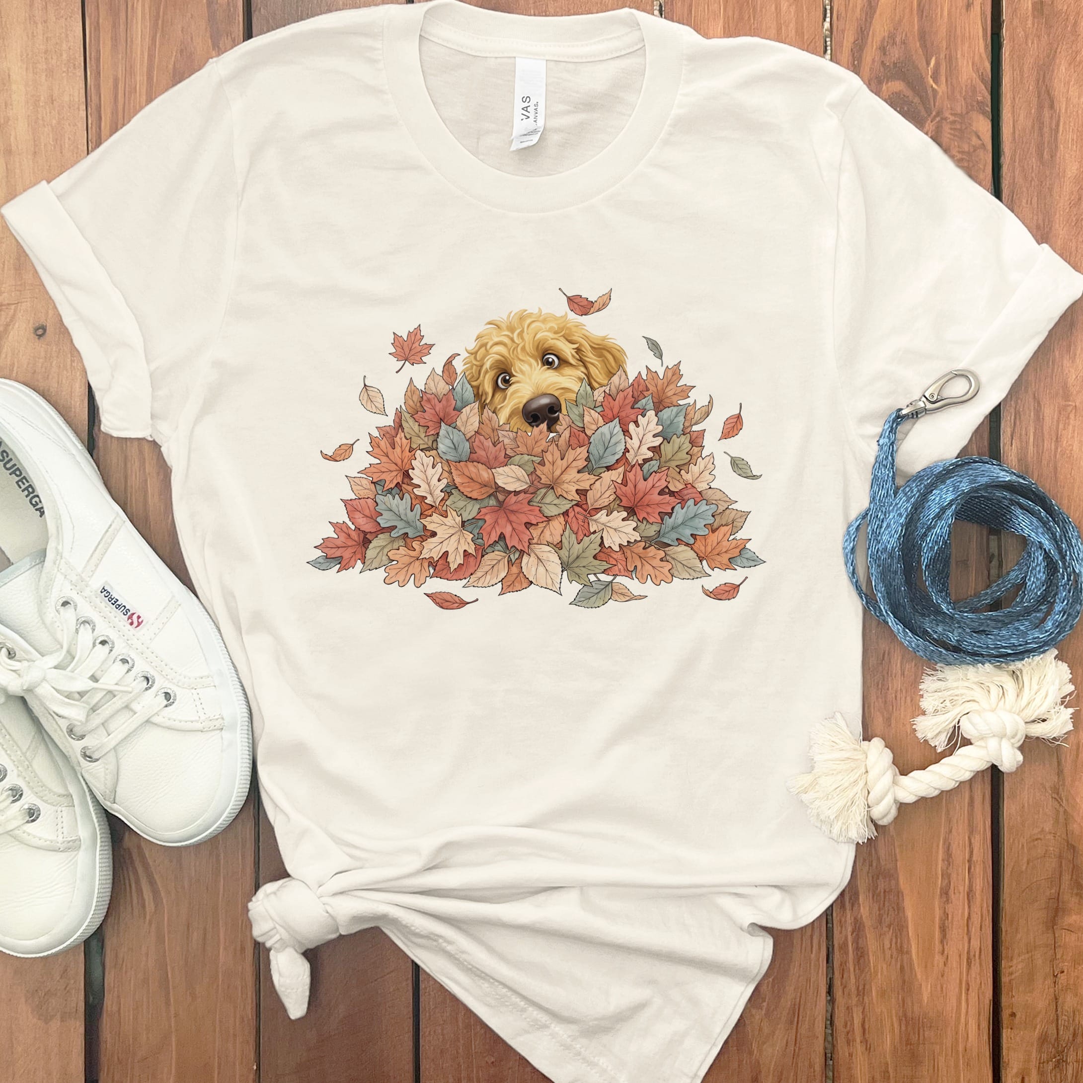 Golden Goldendoodle Peeking Leaf Pile T-Shirt in Natural / S by Puppy Jo